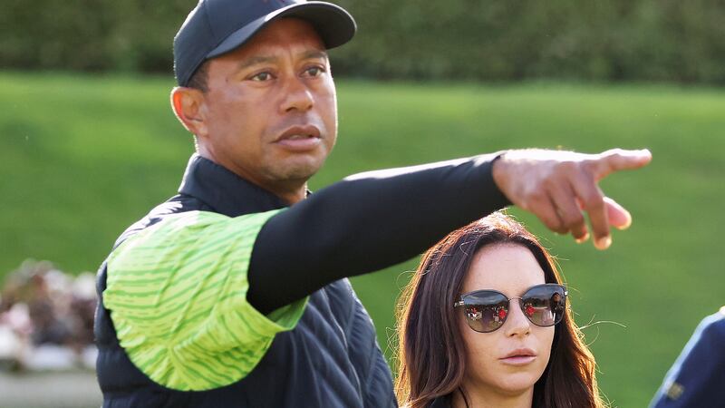 FILE - Tiger Woods and girlfriend Erica Herman on the 18th green during the JP McManus Pro-Am...