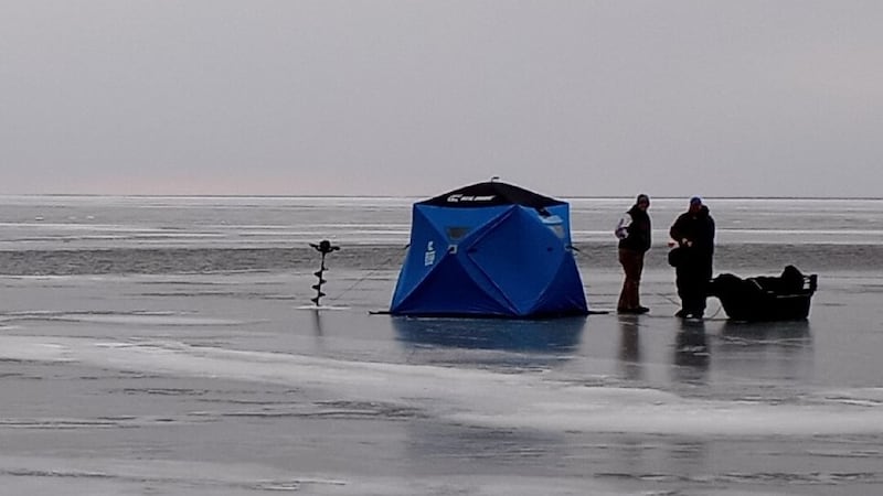 Crews survey the situation on Upper Red Lake Monday afternoon.