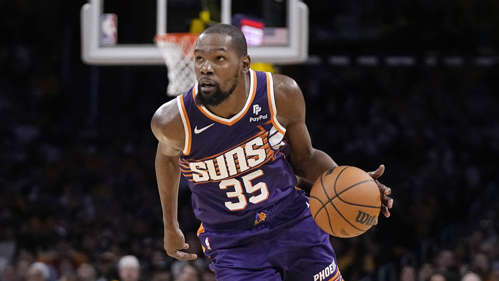 Phoenix Suns forward Kevin Durant drives toward the basket during the second half of an NBA...