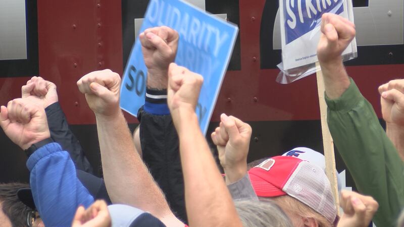 Members with fists in the air