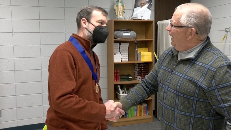 Marty Cormack and Tim Geisler shaking hands