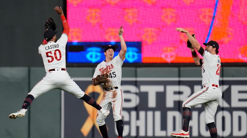 Minnesota Twins left fielder Willi Castro (50), center fielder Andrew Stevenson (45) and right...