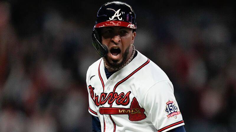 Atlanta Braves' Eddie Rosario celebrates after hitting a three run home run during the fourth...