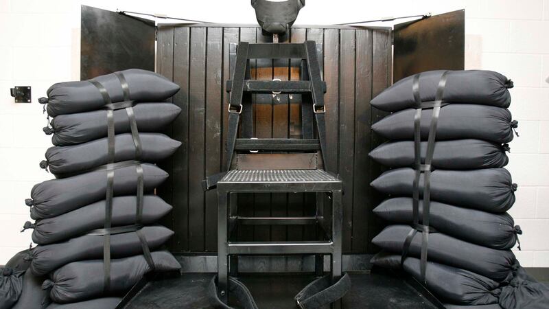 FILE - A chair sits in the execution chamber at the Utah State Prison on June 18, 2010, after...