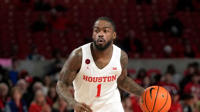 Houston's Jamal Shead (1) brings the ball up the court against Texas A&M-Corpus Christi during...